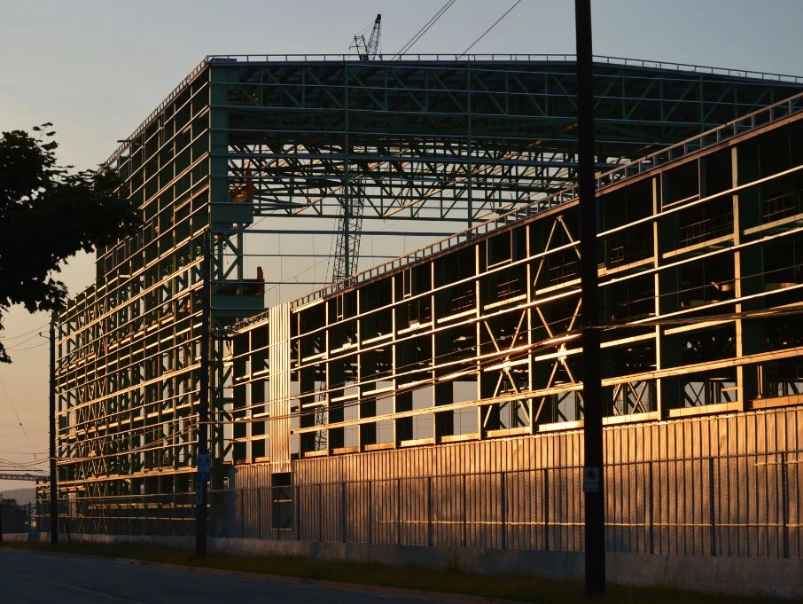 A large metal building, showcasing the design of a pre-engineered structure by a manufacturer