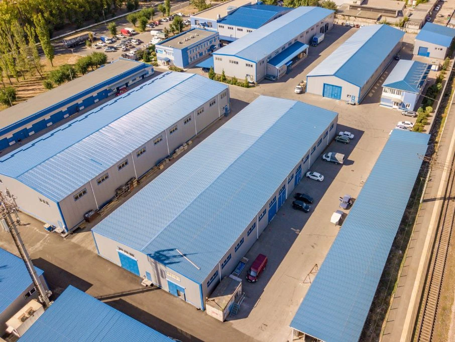 A large pre-engineered industrial building, highlighting its design and layout within the landscape