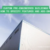 Wide-span custom pre-engineered steel warehouse exterior with clear-span design under blue sky