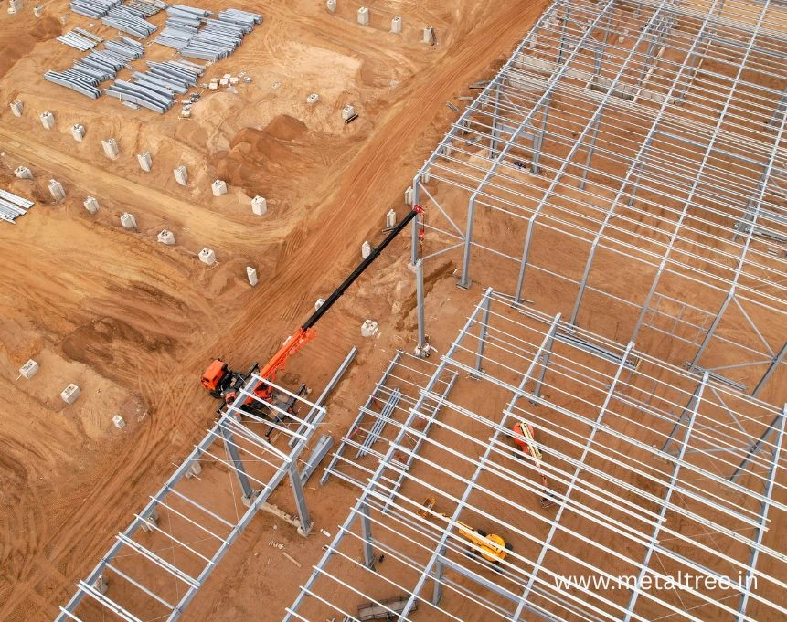 Pre-engineered building warehouse with steel frame construction showing clear span design and modular assembly for industrial storage applications