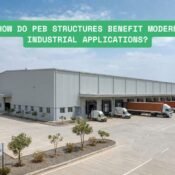 Modern pre-engineered steel warehouse with wide clear-span structure and loading bays for industrial logistics operations.