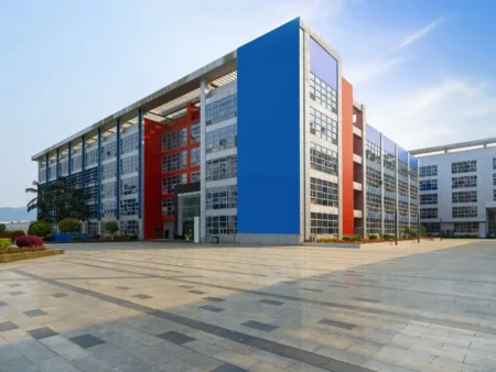 A Large Pre Engineered Government Building Featuring Blue And Red Walls Designed For Administrative Purposes