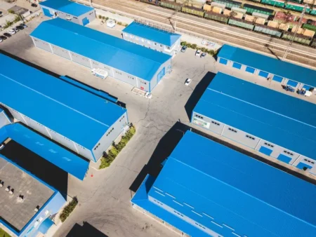 Overhead View Of A Large Industrial Structure With Blue Roofs Showcasing Metal Tree A Manufacturer Of Pre Engineered Buildings